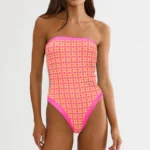 Shop Ambrose One Piece Citrus Tile featuring a vibrant citrus tile print, flattering silhouette, and comfortable design for beach and pool wear.